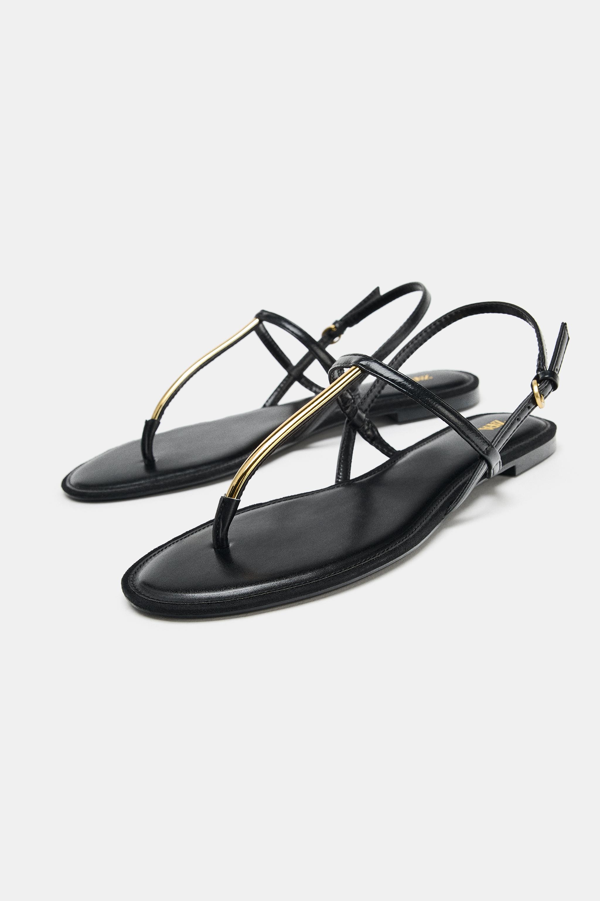 FLAT SANDALS WITH METALLIC APPLIQUE